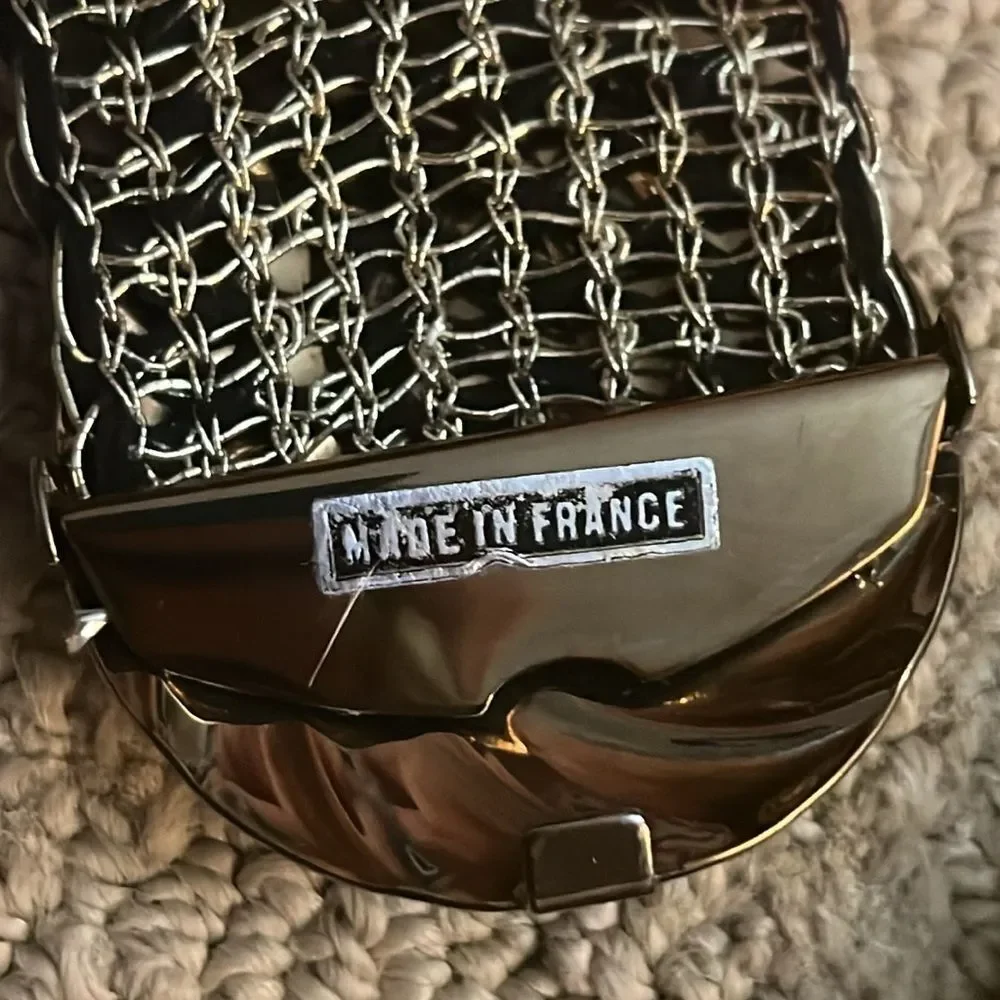 Metallic black and gold woven belt with metal buckle